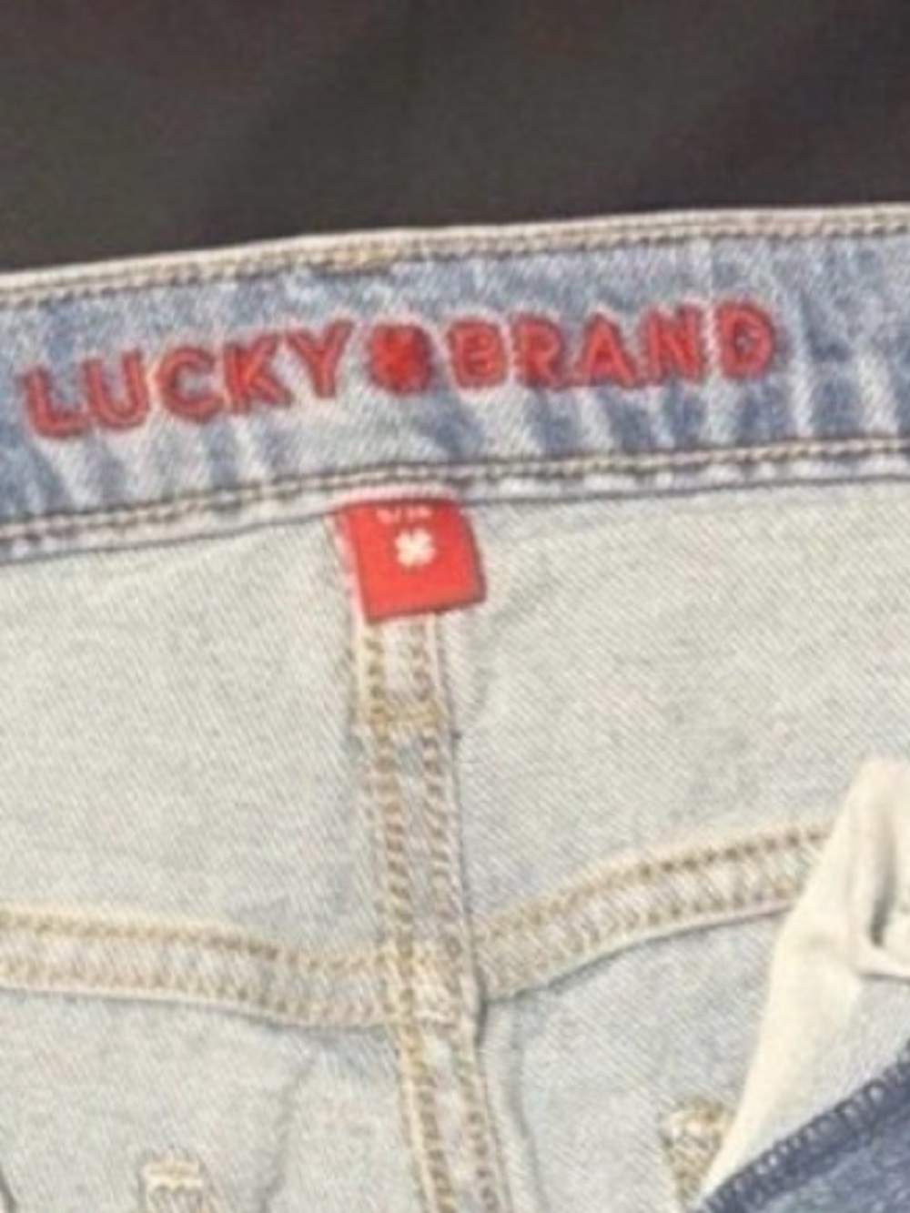 Lucky Brand Women's Faded Blue High-Rise Jeans with Red Logo